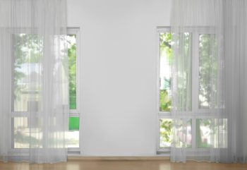 Sheer curtains covering glass windows